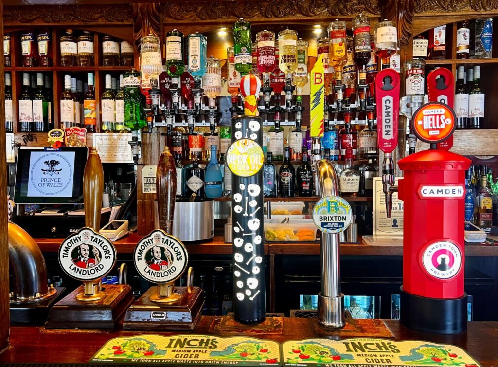 Classic selection of cask ales, and imported selection of international drinks on display at the Prince of Wales bar in Pimlico SW1, London