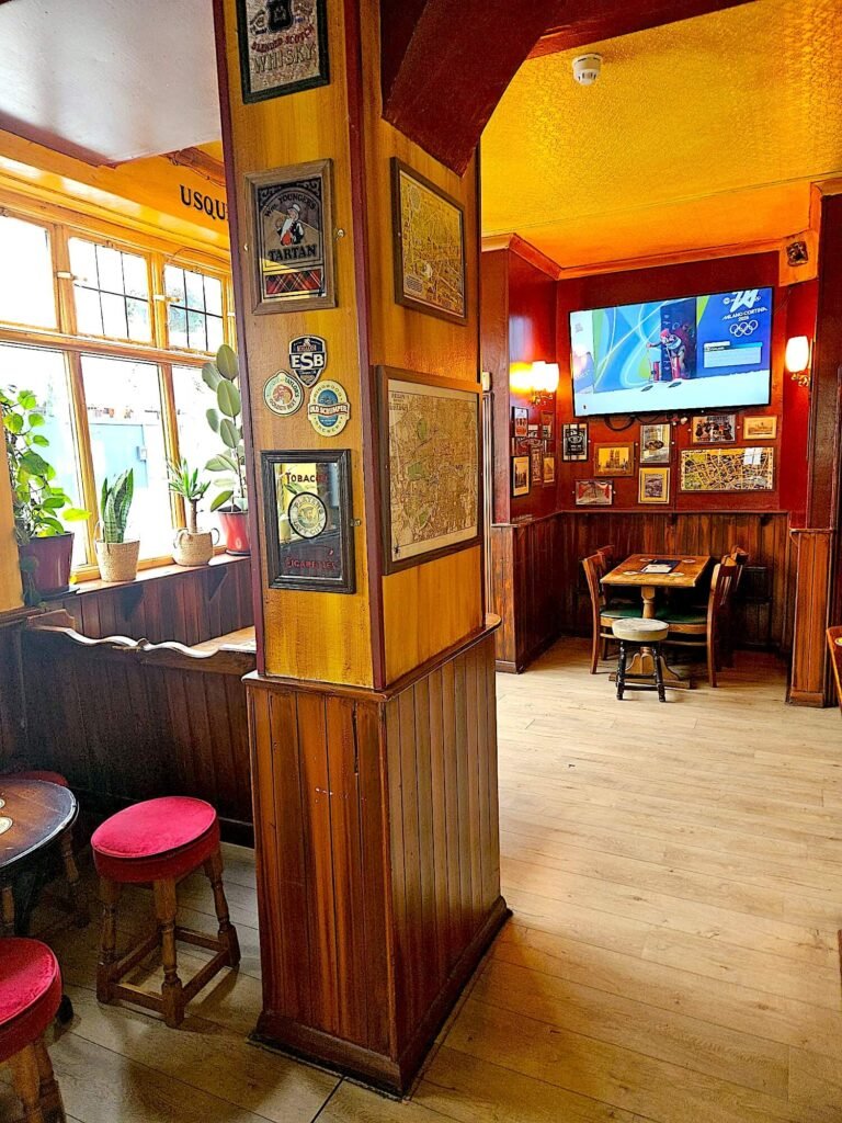 Warmly lit pub interior with vintage décor in The Prince of Wales Pimlico SW1, London